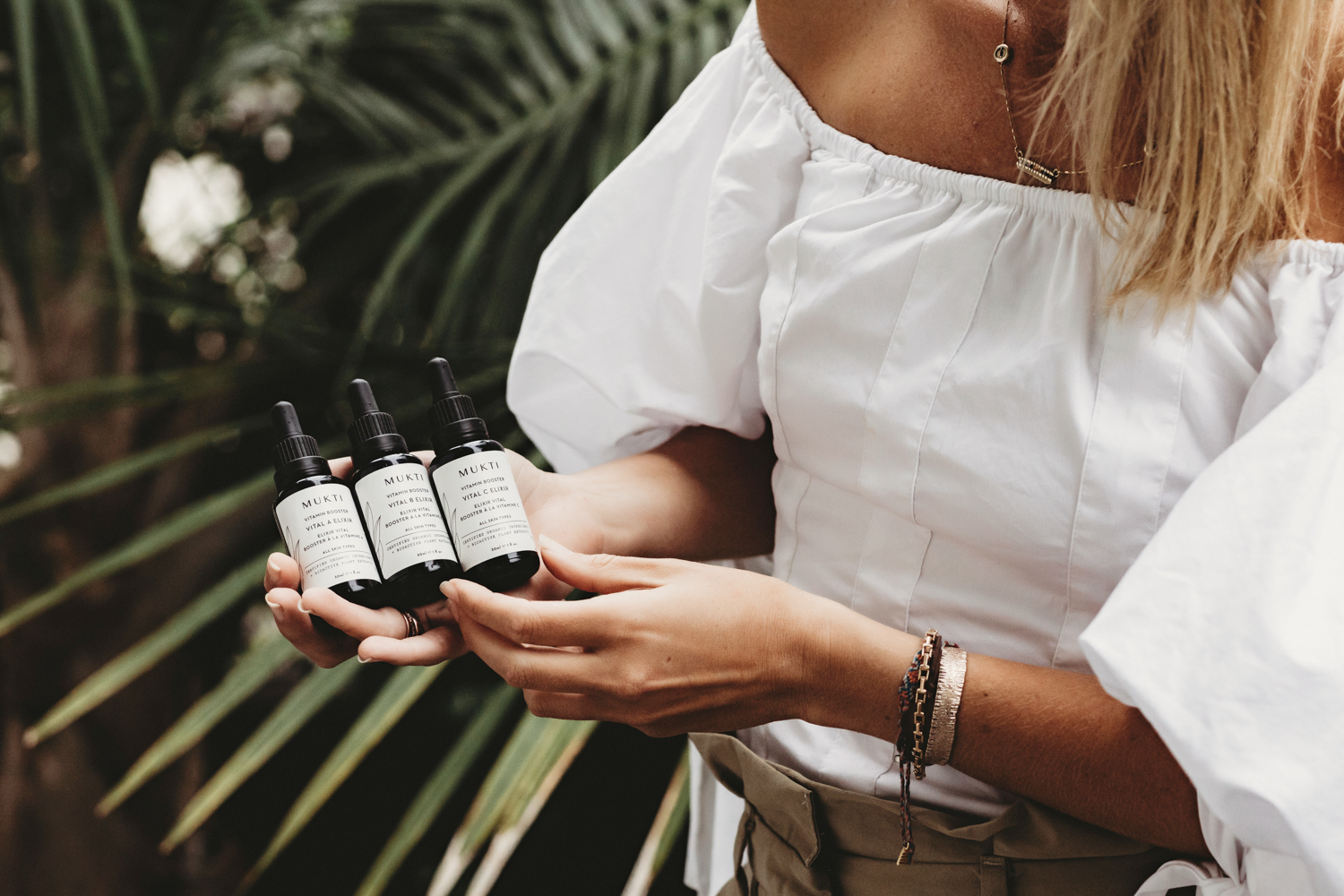 Holding Mukti Vitamin Booster elixirs