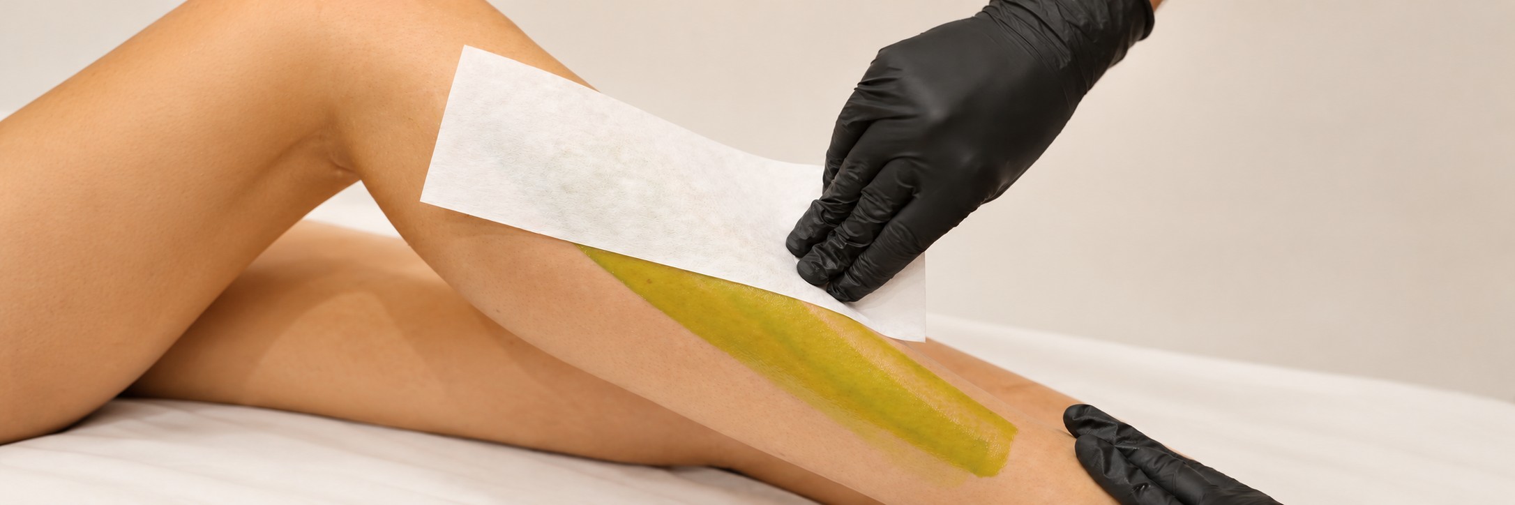Close-up of a leg waxing treatment